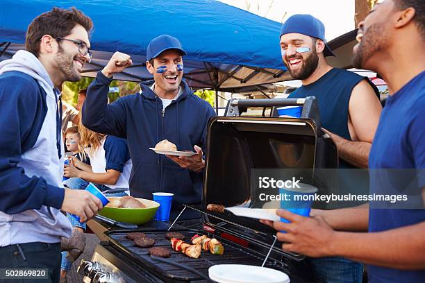 Group Of Male Sports Fans Tailgating In Stadium Car Park Stock Photo - Download Image Now