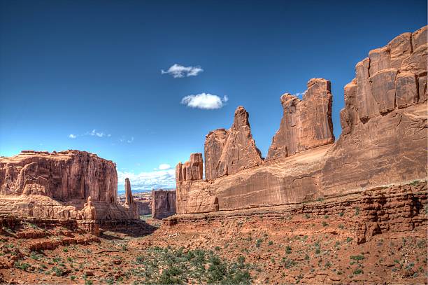 istock Red rock piling high into the blue sky 502870348