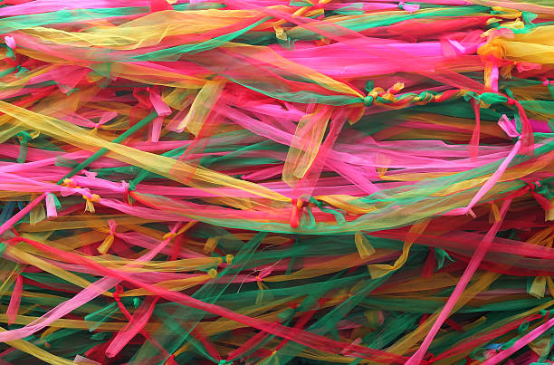 istock Strips of different colored fabric ribbons decorate a bodhi tree 502871212