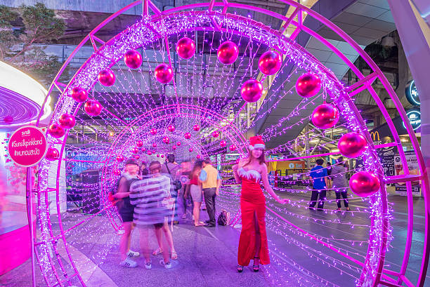 Bangkok, Thailand - December 22, 2015 : Unidentified people in blur motion visit Centralworld shopping mall at night, welcome to Christmas and Happy New Year 2016 festival near Ratchaprasong junction in Bangkok, Thailand.