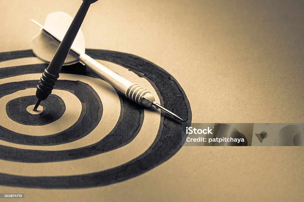 Target Dart hit on the center of sketching dartboard 2015 Stock Photo