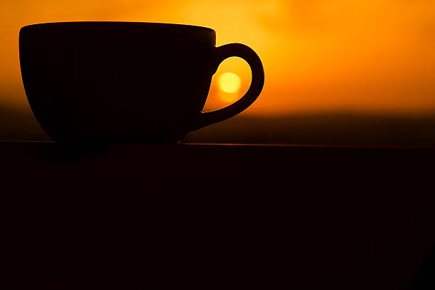 istock Romantic cup of coffee or tea with sunset 502884852