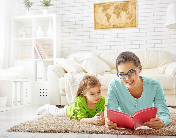 istock mother reading to daughter 502886584
