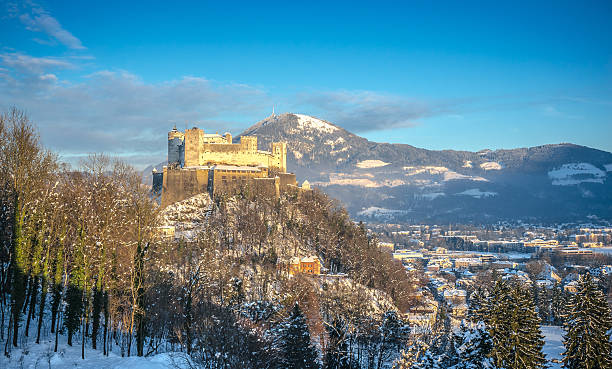 Famous Hohensalzburg Fortress at sunset in winter, Salzburg, Austria Beautiful view of famous Hohensalzburg Fortress at sunset in winter, Salzburg, Salzburger Land, Austria gaisberg stock pictures, royalty-free photos & images