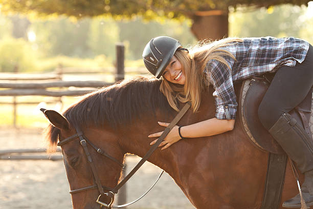 istock Young woman riding horse 502888505