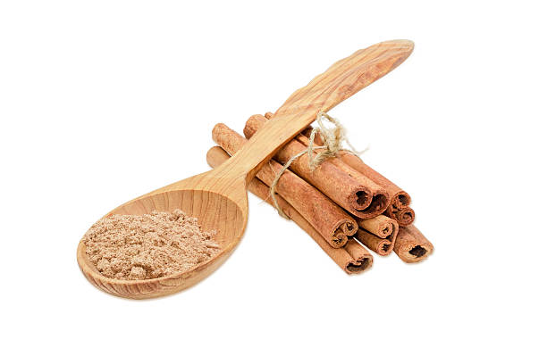 istock Cinnamon sticks and cinnamon powder on a light background 502889994