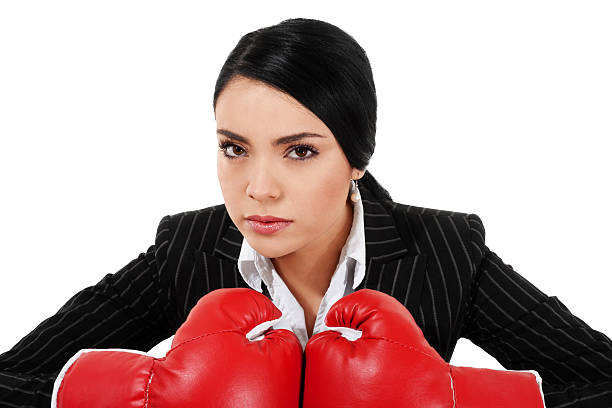 séance femme d'affaires - women business strength boxing photos et images de collection