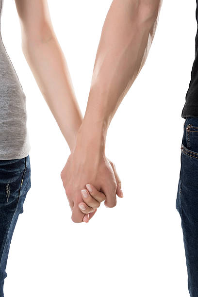 istock Man and woman holding hands 502891645