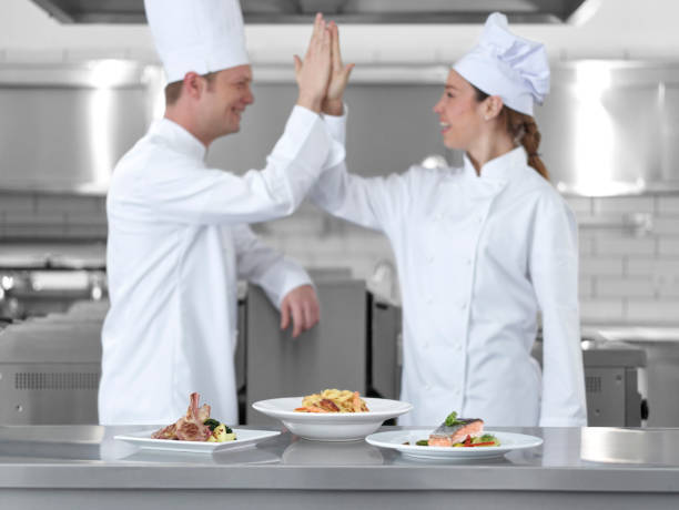 istock Chef celebrating behind the dishes 502893112