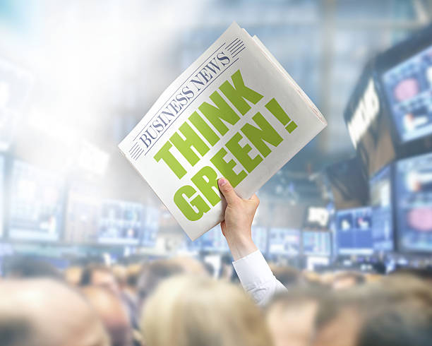 istock Holding Newspaper with Think Green 502893119