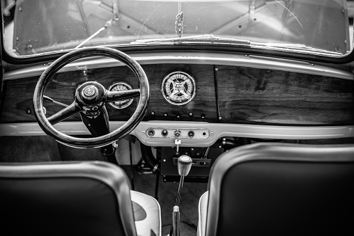 Brampton, Ontario, Canada- May 25, 2014. Cabin Interior of Iconic  Mini Cooper CLASSIC compact car parked on the street  at at Brampton suburbs near Toronto, Ontario. This is a British  classic car still in very nice driving condition for it's age, including all custom made details. Mini has been around since 1959 and has been owned and issued by various car manufacturers.