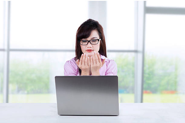 istock Businesswoman praying in office 502893959