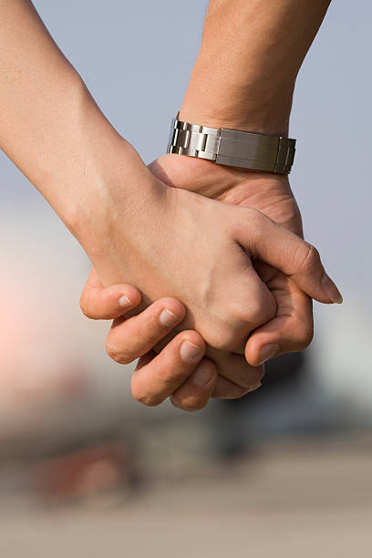 istock young couple holding hands, outdoors 502893980
