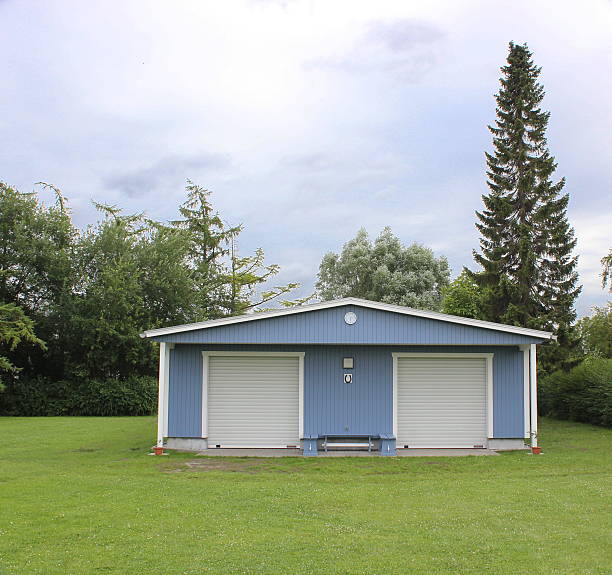 Lawn with a boat house. Image was created using a HDR imaging technique.