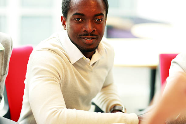 istock african man sitting at the table 502895361