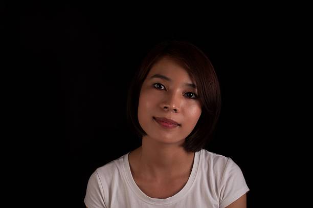 Young Vietnamese Girl on Black stock photo