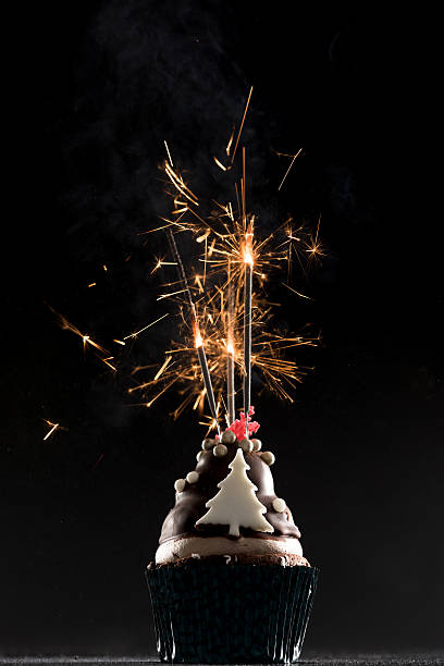 istock Cup cake with firework and birthday candles 502895538
