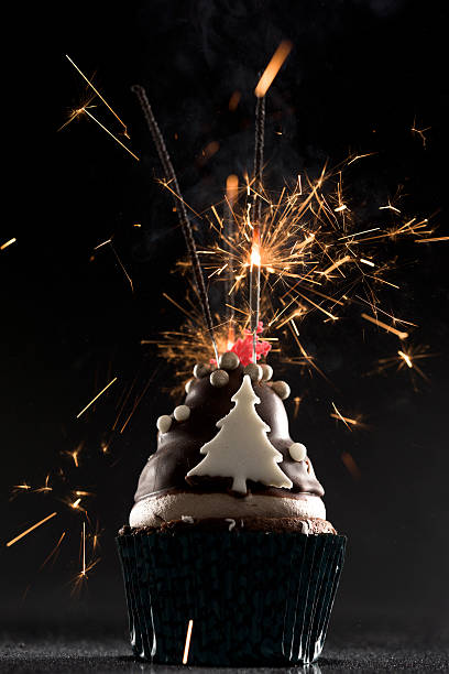 istock Cup cake with firework and birthday candles 502895616
