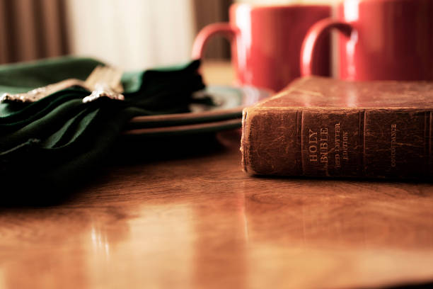 istock Closed Bible and morning coffee cups on breakfast table. 502895993