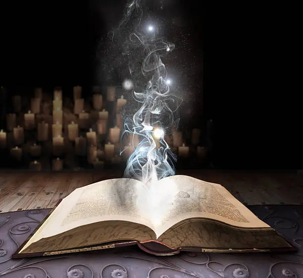 spell book with smoke emanating from pages