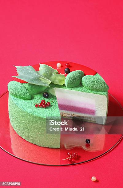 Piece Of Celebration Matcha And Currants Mousse Cake Stock Photo - Download Image Now