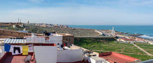 Panoramic view of the Rabat cemetery and Atlantic coast in background. View from the rooftops of Kasbah of the Udayas. .Rabat, Morocco. North Africa.