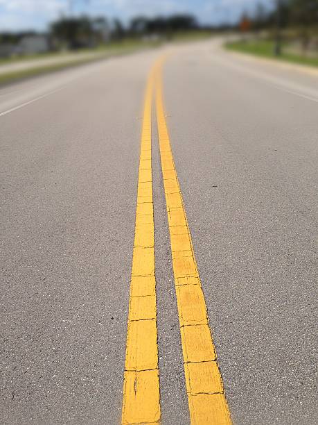 istock Double yellow line in middle of road 502899758