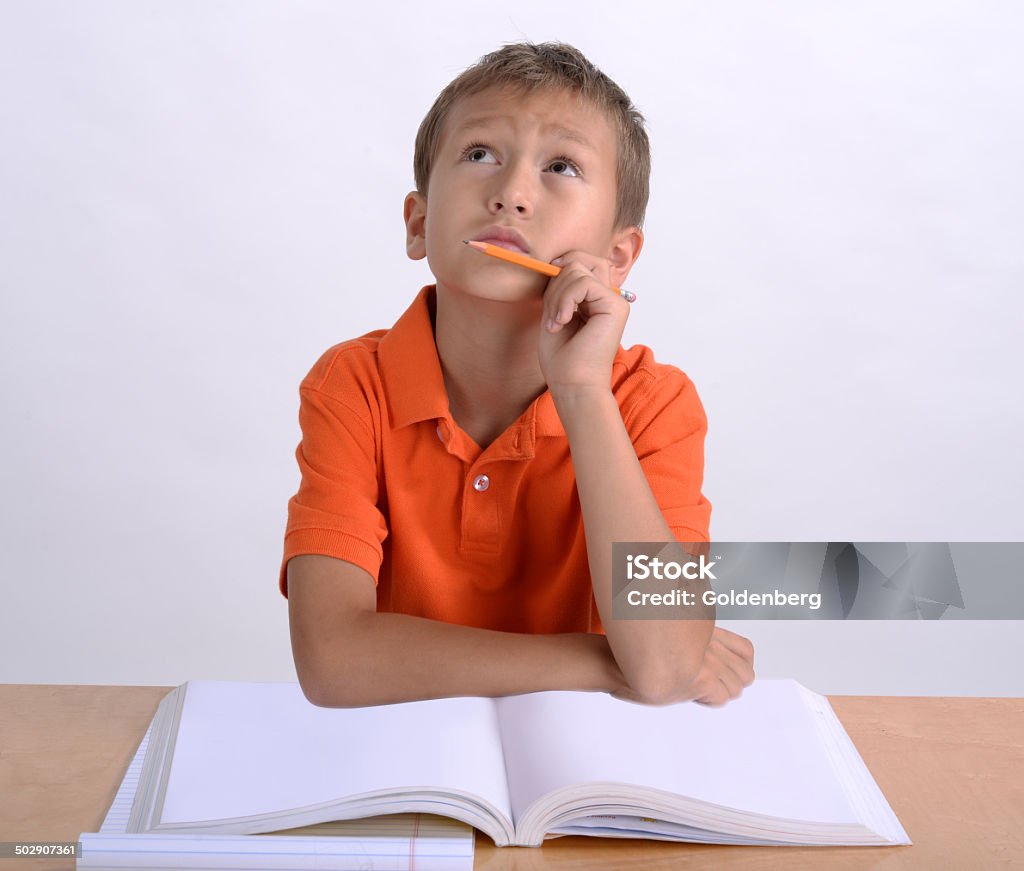 Boy doing homework Child Stock Photo