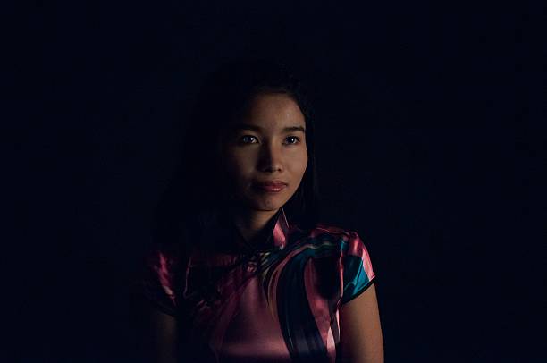 Young Vietnamese Girl on Black stock photo