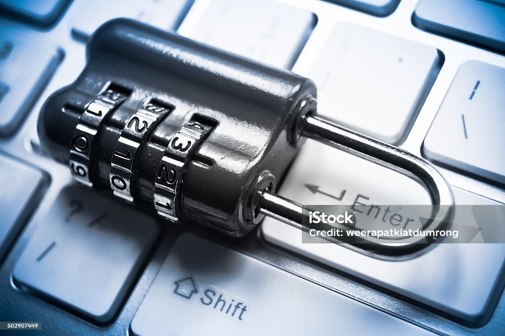 computer security metal security lock with password on computer keyboard - security concept in computer Accessibility Stock Photo