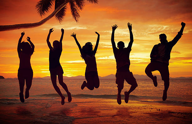 istock Young People Jumping with Excitement on the Beach 502909709