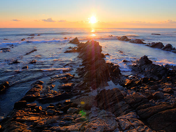 istock Beautiful sunrise over Cretaceous sedimentary rock coastline 502911695