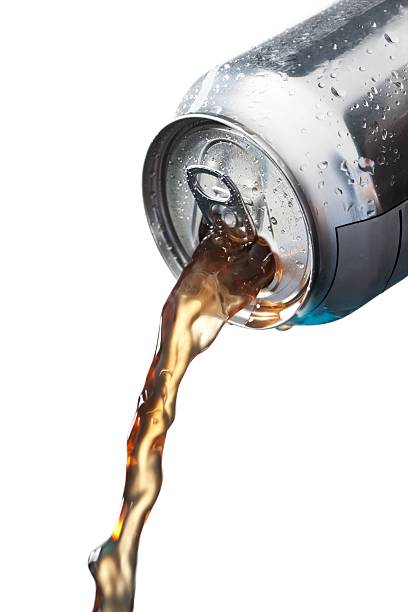 pouring soft drinks in can stock photo