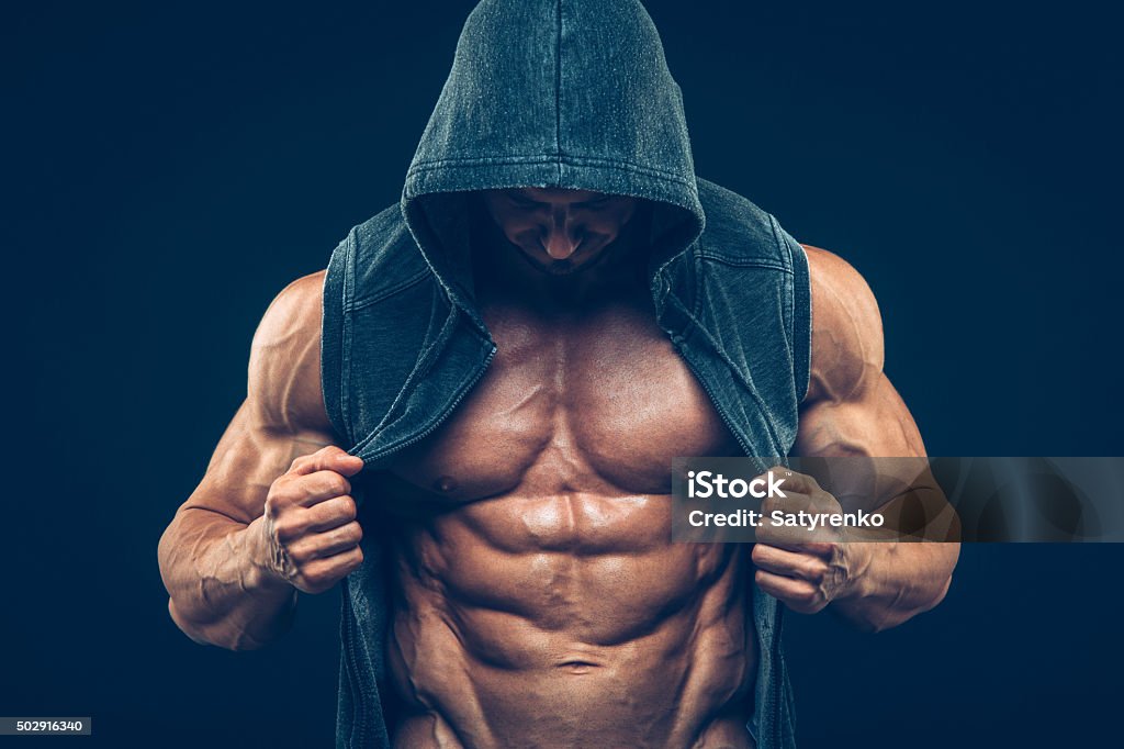 Man with muscular torso. Strong Athletic Men Fitness Model Torso Man with muscular torso. Strong Athletic Man Fitness Model Torso showing six pack abs Body Building Stock Photo