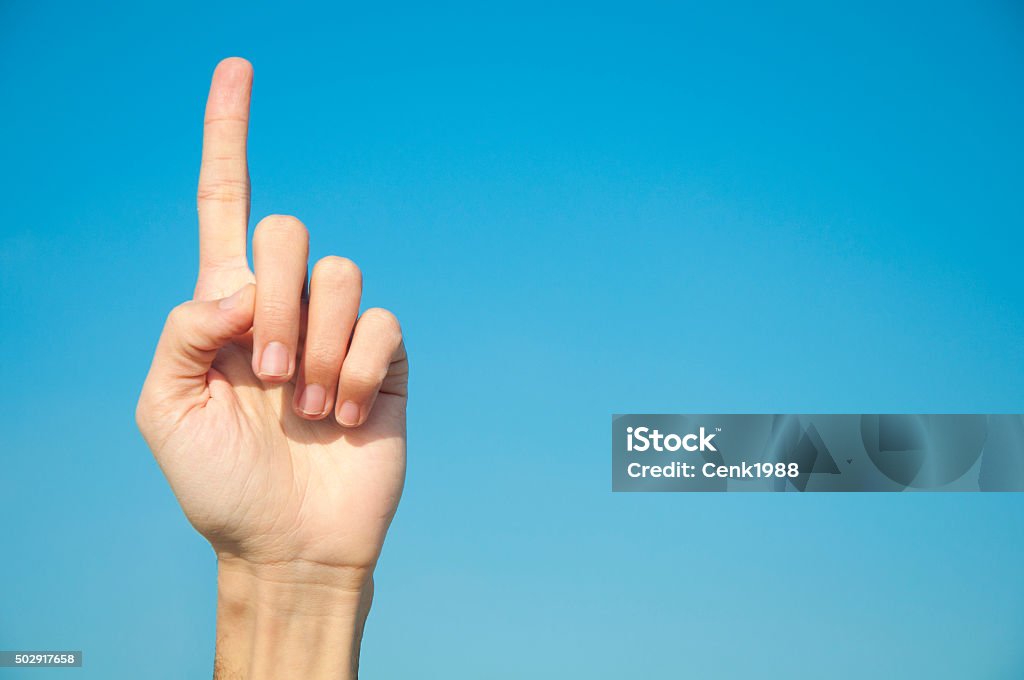 Man's hand with the index finger Man's hand with the index finger. 2015 Stock Photo