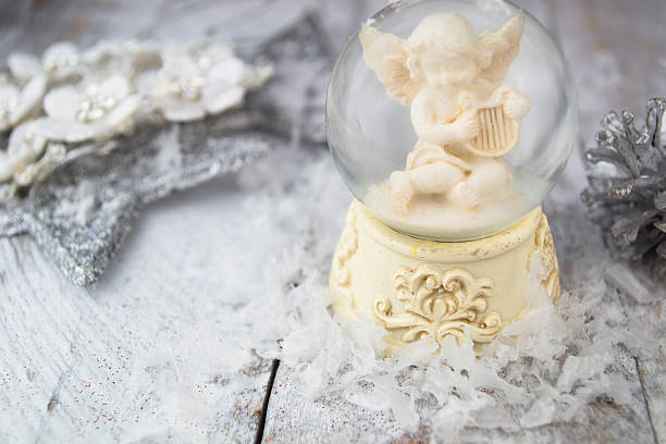 istock Christmas angel statuette on silver background 502919058