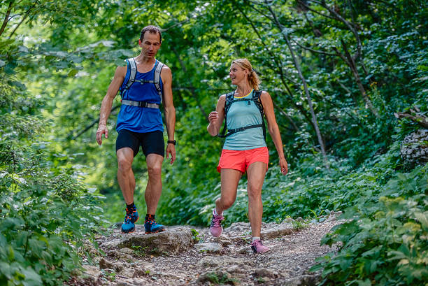 istock Couple walking on a rocky path in the woods 502919126