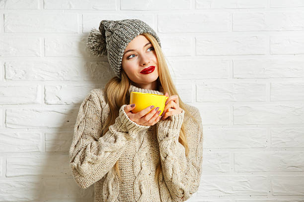 Romantic Dreaming Winter Hipster Girl with a Mug stock photo