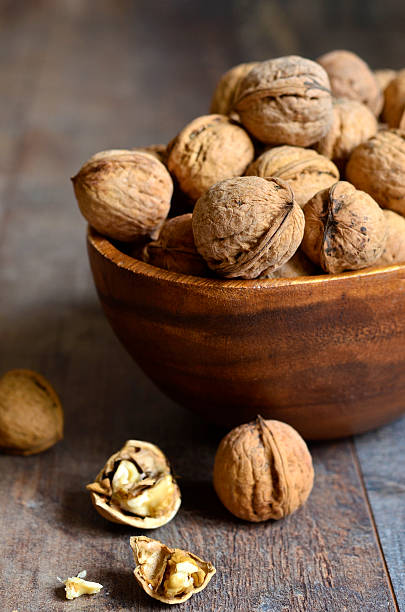istock Walnuts in a wooden bowl 502921466