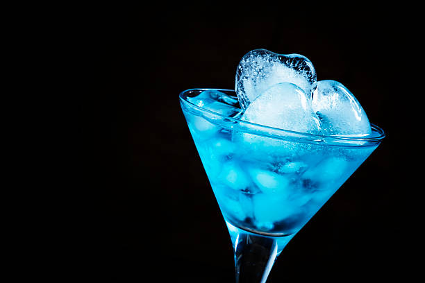 istock Blue cocktail in a martini glass with ice 502923480