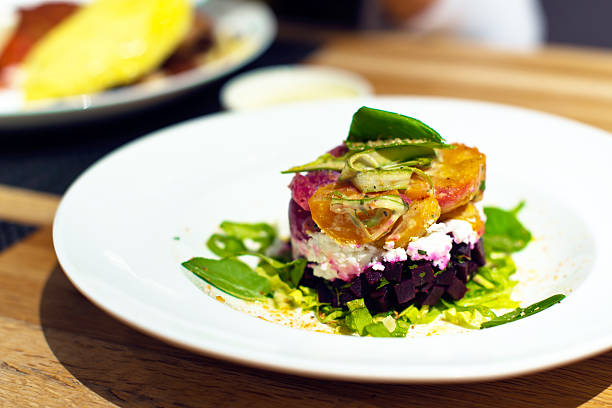 istock Exotic vegetable salad greens and cheese on round plate 502931161