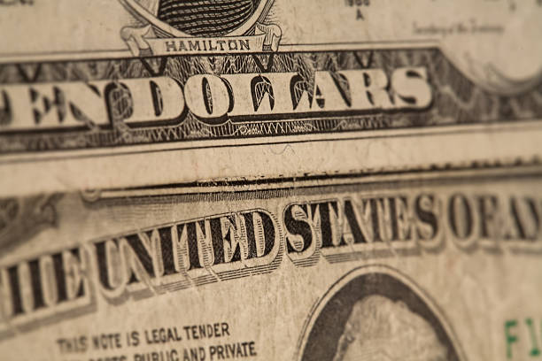 istock US dollars background, reto style toned photo with shallow DOF 502931777