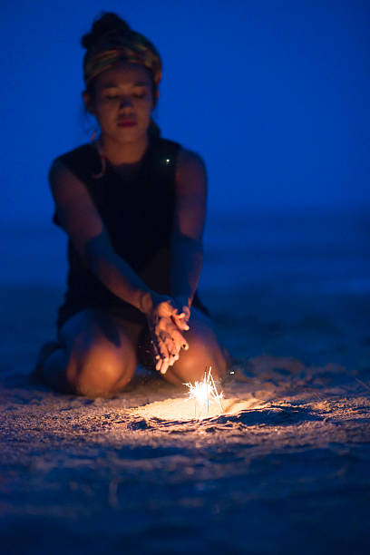 istock Woman With Sparkles On The Beach 502933433