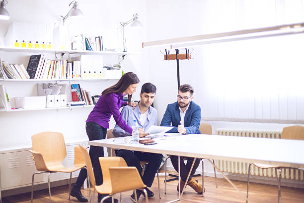 istock Young Professionals Discussing Ideas at a Meeting 502933578