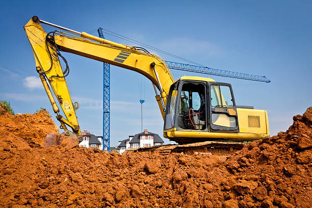 istock Yellow excavator digging into the ground 502934695