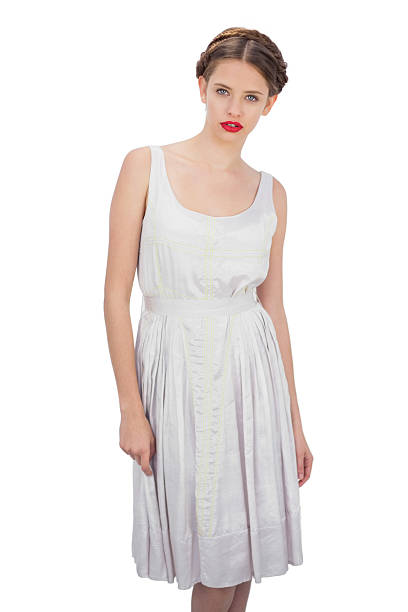 istock Serious model in white dress posing looking at camera 502936113