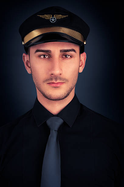 istock Man with Pilot Hat and Black Shirt Portrait 502936171