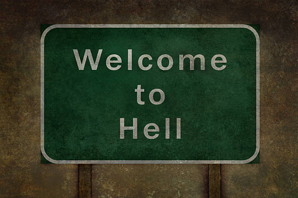 Ominous welcome to hell highway road side sign with grunge type distressed treatment.