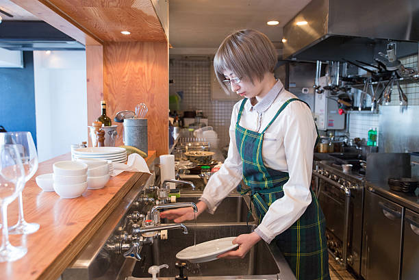 istock Young japanese lady woking at kitchen 502937380