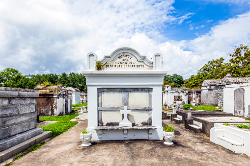New Orleans, USA - July 16, 2013: Lafayette cemetery with historic Grave Stones in New Orleans, USA. Built in what was once the City of Lafayette, the cemetery was officially established in 1833.